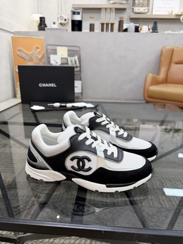 sy_no_4EC2EE923632FAB90C4C005F8F34B381_1 Chanel Black & White Chunky Sneaker with Silver Accents & Interlocking CC Logo