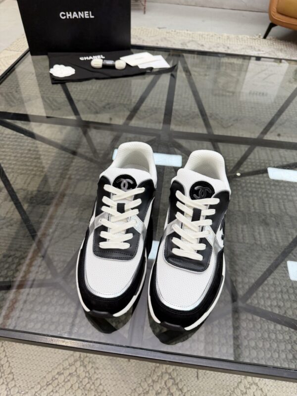 sy_no_4EC2EE923632FAB90C4C005F8F34B381_2 Chanel Black & White Chunky Sneaker with Silver Accents & Interlocking CC Logo