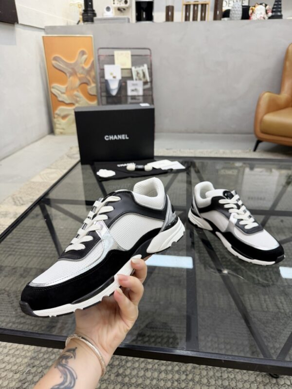 sy_no_4EC2EE923632FAB90C4C005F8F34B381_3 Chanel Black & White Chunky Sneaker with Silver Accents & Interlocking CC Logo