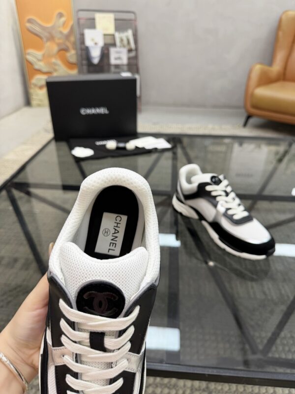 sy_no_4EC2EE923632FAB90C4C005F8F34B381_6 Chanel Black & White Chunky Sneaker with Silver Accents & Interlocking CC Logo