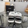 sy_no_4EC2EE923632FAB90C4C005F8F34B381_7 Chanel Black & White Chunky Sneaker with Silver Accents & Interlocking CC Logo