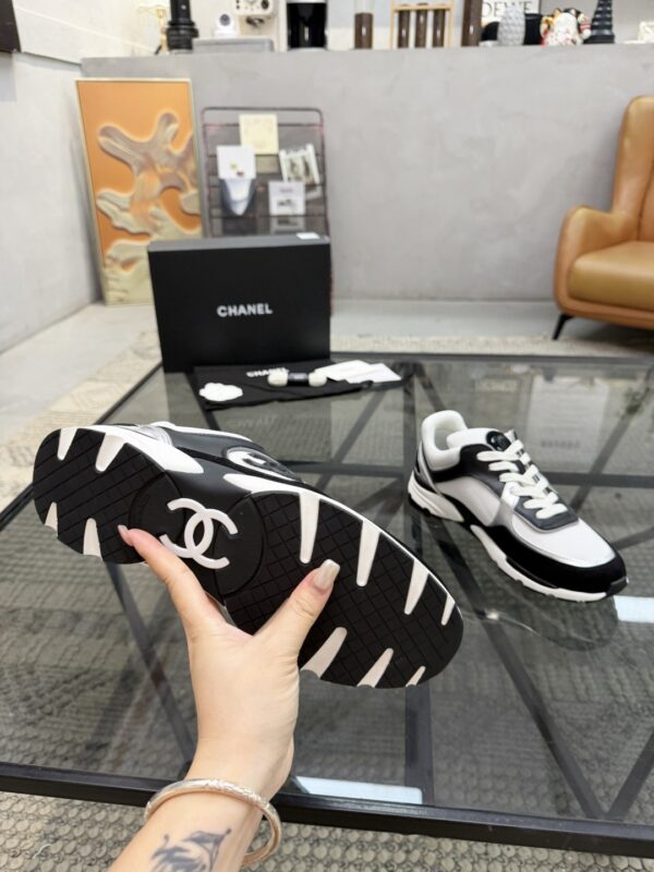 sy_no_4EC2EE923632FAB90C4C005F8F34B381_8 Chanel Black & White Chunky Sneaker with Silver Accents & Interlocking CC Logo