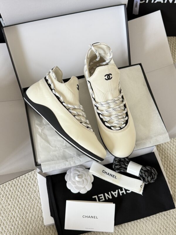 sy_no_4ECFFEC9493623F806A804E19FAFC83C_1 Chanel White Leather and Knit Slip-On Low-Top Sneaker with Speckled Laces and CC Logo