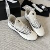 sy_no_4ECFFEC9493623F806A804E19FAFC83C_2 Chanel White Leather and Knit Slip-On Low-Top Sneaker with Speckled Laces and CC Logo