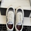 Chanel White and Grey Mesh and Suede Low-Top Sneaker with Black Toe Cap and CC Logo