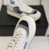 Chanel White and Grey Mesh and Suede Low-Top Sneaker with Black Toe Cap and CC Logo