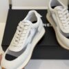 Chanel White and Grey Mesh and Suede Low-Top Sneaker with Black Toe Cap and CC Logo