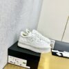 sy_no_509CAC2AF239607C0340A2E896A8C9F1_0 Chanel Off-White Leather Platform Low-Top Sneaker with Perforated CC Logo and Ribbed Sole