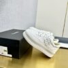 sy_no_509CAC2AF239607C0340A2E896A8C9F1_3 Chanel Off-White Leather Platform Low-Top Sneaker with Perforated CC Logo and Ribbed Sole