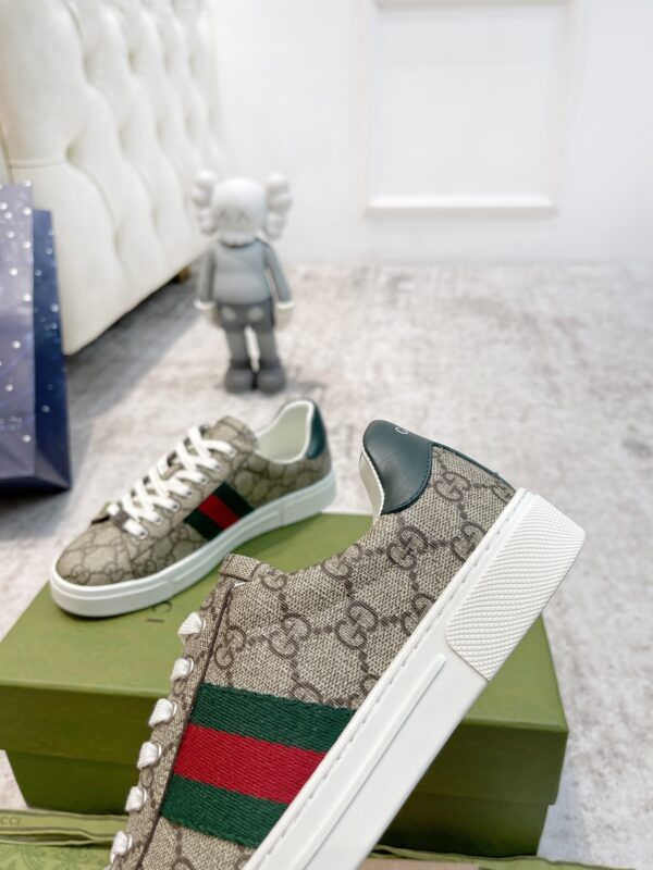 sy_no_50A03DABACE1793DB33D2E2F5B411E41_7 Gucci Screener GG Supreme Canvas Sneaker with Web Stripe