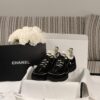 sy_no_523BE4E99C4E61DD3F343F5F8F08DFA5_0 Chanel Black and White Mixed Material Low-Top Sneaker with Contrast Piping and CC Logo