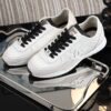 Chanel White and Black Mixed Material Low-Top Sneaker with Suede and CC Logo