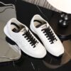 Chanel White and Black Mixed Material Low-Top Sneaker with Suede and CC Logo