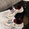 sy_no_560C0E2DD154136B20A24989179C93C6_2 Chanel Off-White and Burgundy Mixed Material Low-Top Sneaker with Contrast Piping and CC Logo
