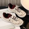 sy_no_560C0E2DD154136B20A24989179C93C6_3 Chanel Off-White and Burgundy Mixed Material Low-Top Sneaker with Contrast Piping and CC Logo