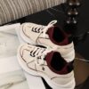 sy_no_560C0E2DD154136B20A24989179C93C6_5 Chanel Off-White and Burgundy Mixed Material Low-Top Sneaker with Contrast Piping and CC Logo