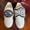 sy_no_5DE36B953E19D4D130FF8C8A0A3E6048_3 Gucci White Leather Low-Top Sneaker with Embroidered Eye and Bow Flaps