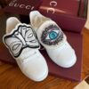 sy_no_5DE36B953E19D4D130FF8C8A0A3E6048_7 Gucci White Leather Low-Top Sneaker with Embroidered Eye and Bow Flaps