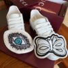 sy_no_5DE36B953E19D4D130FF8C8A0A3E6048_8 Gucci White Leather Low-Top Sneaker with Embroidered Eye and Bow Flaps