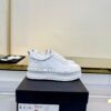 Chanel All-White Leather Platform Low-Top Sneaker with Embossed Heel Logo and Ribbed Sole