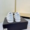 Chanel All-White Leather Platform Low-Top Sneaker with Embossed Heel Logo and Ribbed Sole