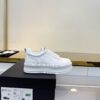 Chanel All-White Leather Platform Low-Top Sneaker with Embossed Heel Logo and Ribbed Sole