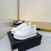 Chanel All-White Leather Platform Low-Top Sneaker with Embossed Heel Logo and Ribbed Sole