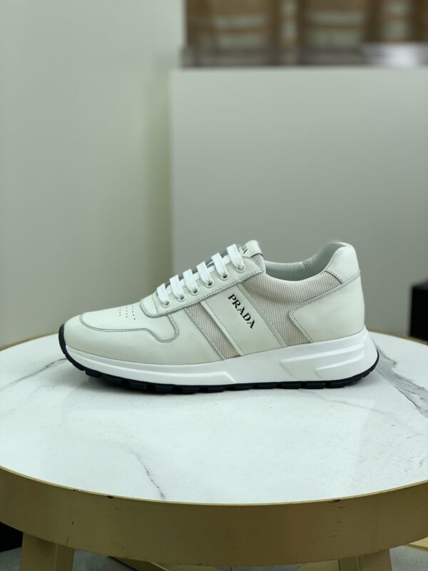 sy_no_6718CC9728BE8F3F6D7BD3F93117451A_0 Prada Off-White Leather Mesh Retro Running Sneaker