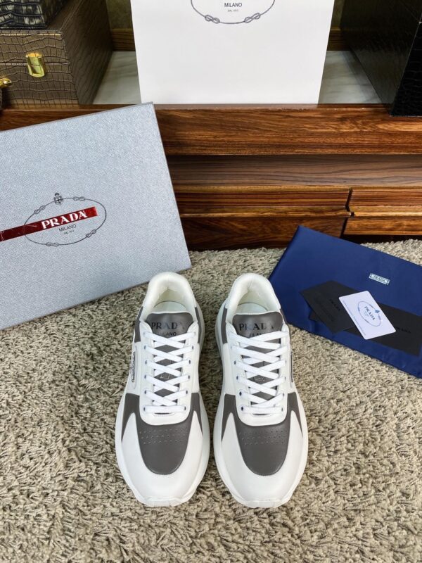 sy_no_67CFDDA6DA2DF1E67CD827184E08E911_0 Prada White Grey Leather Triangle Chunky Sneaker
