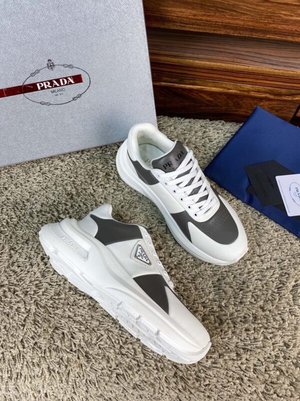 sy_no_67CFDDA6DA2DF1E67CD827184E08E911_2 Prada White Grey Leather Triangle Chunky Sneaker
