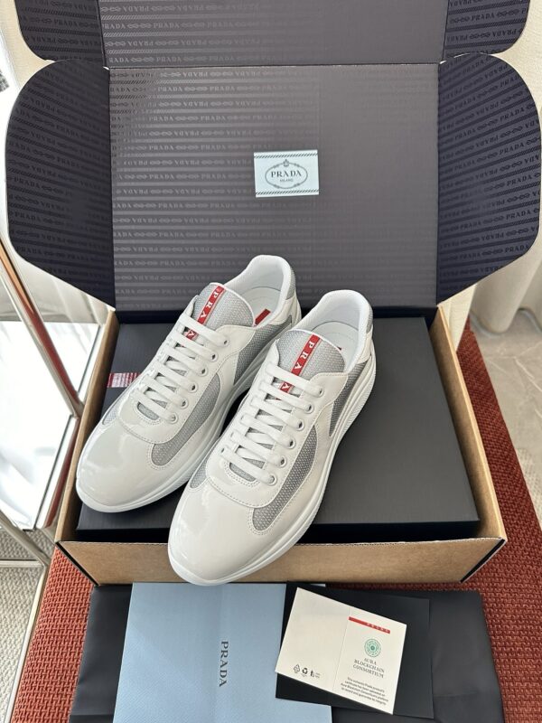 sy_no_6EBBF7D5192BB87716B40E52E28C5156_0 Prada White Patent Silver Mesh Red Label Sneaker