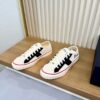 sy_no_716ED651878C2C856E9860857D9D38BA_1 Dior White-Black Canvas Low Sneaker
