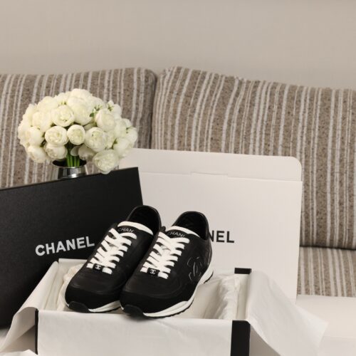 Chanel Black and White Leather Low-Top Sneaker with Suede Toe Cap and CC Logo