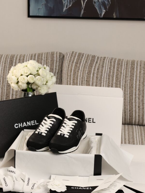sy_no_7281AD9259070FB5D9F5F654A2AB23D1_0 Chanel Black and White Leather Low-Top Sneaker with Suede Toe Cap and CC Logo
