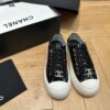 sy_no_751A43FAB37A52E3218B306140ED62C1_1 Chanel Black-White Patent-Leather Low-Top Sneaker with Gold-Tone CC Logo