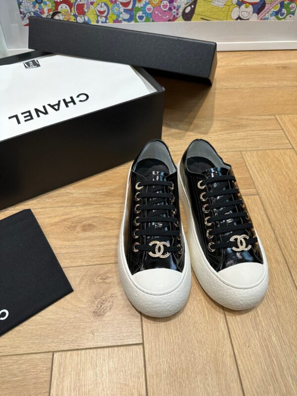 sy_no_751A43FAB37A52E3218B306140ED62C1_1 Chanel Black-White Patent-Leather Low-Top Sneaker with Gold-Tone CC Logo