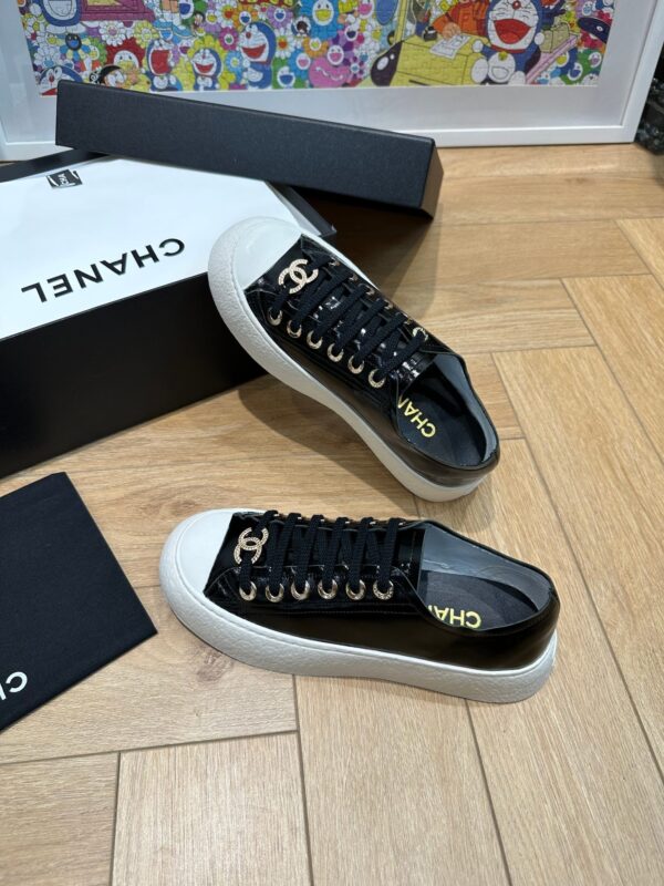 sy_no_751A43FAB37A52E3218B306140ED62C1_2 Chanel Black-White Patent-Leather Low-Top Sneaker with Gold-Tone CC Logo