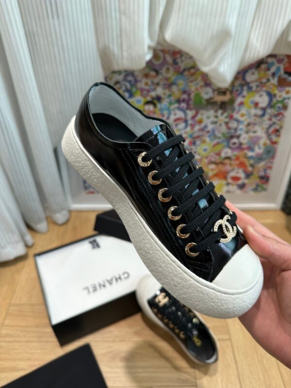 sy_no_751A43FAB37A52E3218B306140ED62C1_3 Chanel Black-White Patent-Leather Low-Top Sneaker with Gold-Tone CC Logo