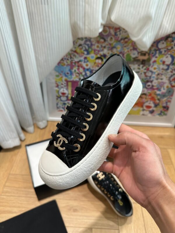 sy_no_751A43FAB37A52E3218B306140ED62C1_4 Chanel Black-White Patent-Leather Low-Top Sneaker with Gold-Tone CC Logo