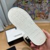sy_no_751A43FAB37A52E3218B306140ED62C1_5 Chanel Black-White Patent-Leather Low-Top Sneaker with Gold-Tone CC Logo