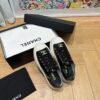 sy_no_751A43FAB37A52E3218B306140ED62C1_7 Chanel Black-White Patent-Leather Low-Top Sneaker with Gold-Tone CC Logo