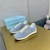 sy_no_774133894272B3D2D2620F328C8A14B6_3 Prada Light Blue Suede Gold Triangle Trainer