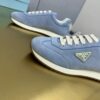 sy_no_774133894272B3D2D2620F328C8A14B6_8 Prada Light Blue Suede Gold Triangle Trainer