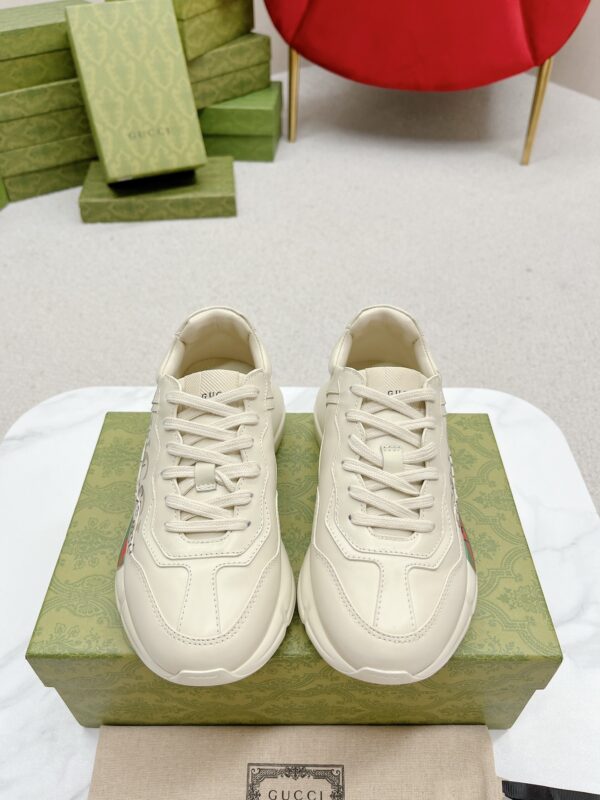 sy_no_7870C34D2272B995D58528D6AC5A952E_0 Gucci Rhyton “Common Sense Is Not That Common” Slogan Sneaker in Off-White