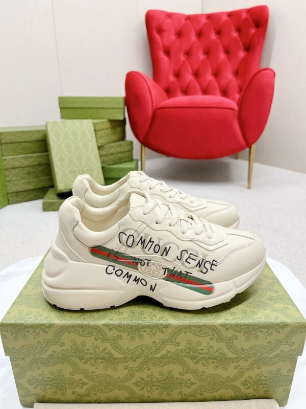 sy_no_7870C34D2272B995D58528D6AC5A952E_1 Gucci Rhyton “Common Sense Is Not That Common” Slogan Sneaker in Off-White