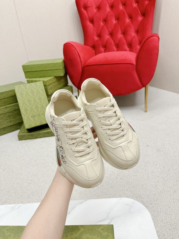 sy_no_7870C34D2272B995D58528D6AC5A952E_2 Gucci Rhyton “Common Sense Is Not That Common” Slogan Sneaker in Off-White