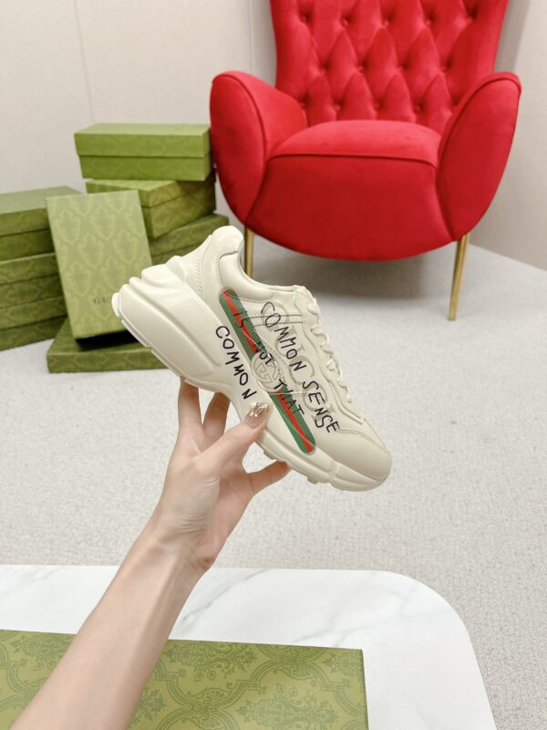sy_no_7870C34D2272B995D58528D6AC5A952E_3 Gucci Rhyton “Common Sense Is Not That Common” Slogan Sneaker in Off-White