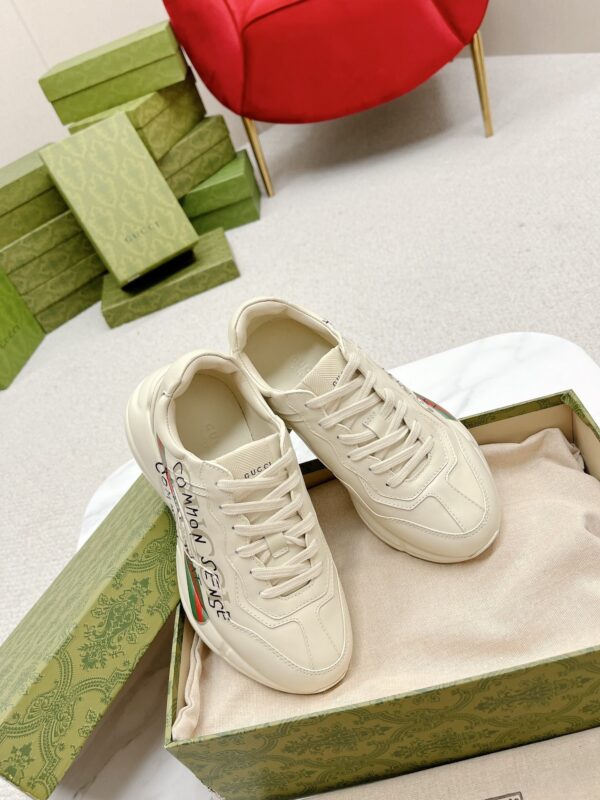 sy_no_7870C34D2272B995D58528D6AC5A952E_5 Gucci Rhyton “Common Sense Is Not That Common” Slogan Sneaker in Off-White