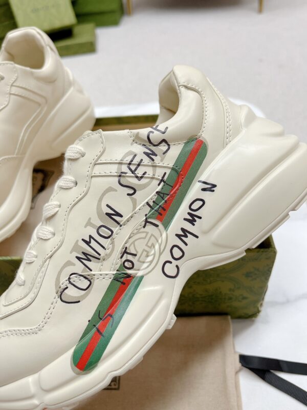 sy_no_7870C34D2272B995D58528D6AC5A952E_7 Gucci Rhyton “Common Sense Is Not That Common” Slogan Sneaker in Off-White