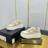 sy_no_7C49A2831C320D9AD271C36179556206_0 Chanel White and Khaki Canvas and Leather Platform Low-Top Sneaker with CC Logo